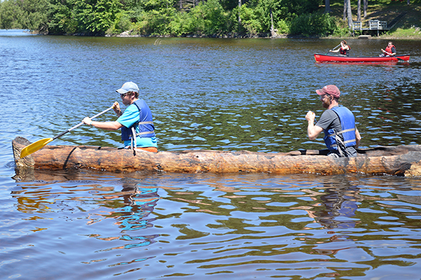 Students riding in a dugout canoe