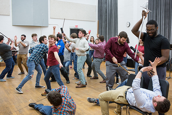 Crane Opera Ensemble students rehearse a fight scene for "The Pirates of Penzance."