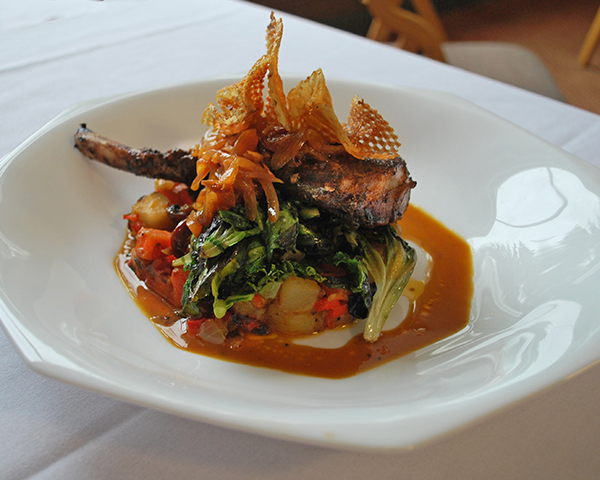 Pan seared mocha rubbed “frenched” pork chop with root vegetable hash