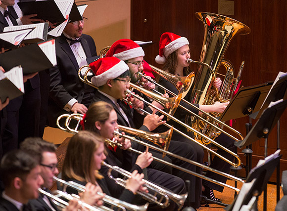 Students in Crane Symphony Orchestra's brass section during 2018 Crane Candlelight Concert.