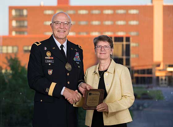 Photo of President Esterberg with Brig. Gen. Dr. Leon L. Robert Jr.