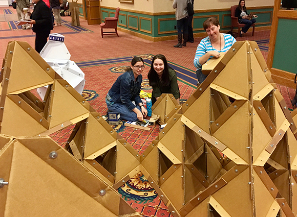 photo of students participating in construction of tetrahedron