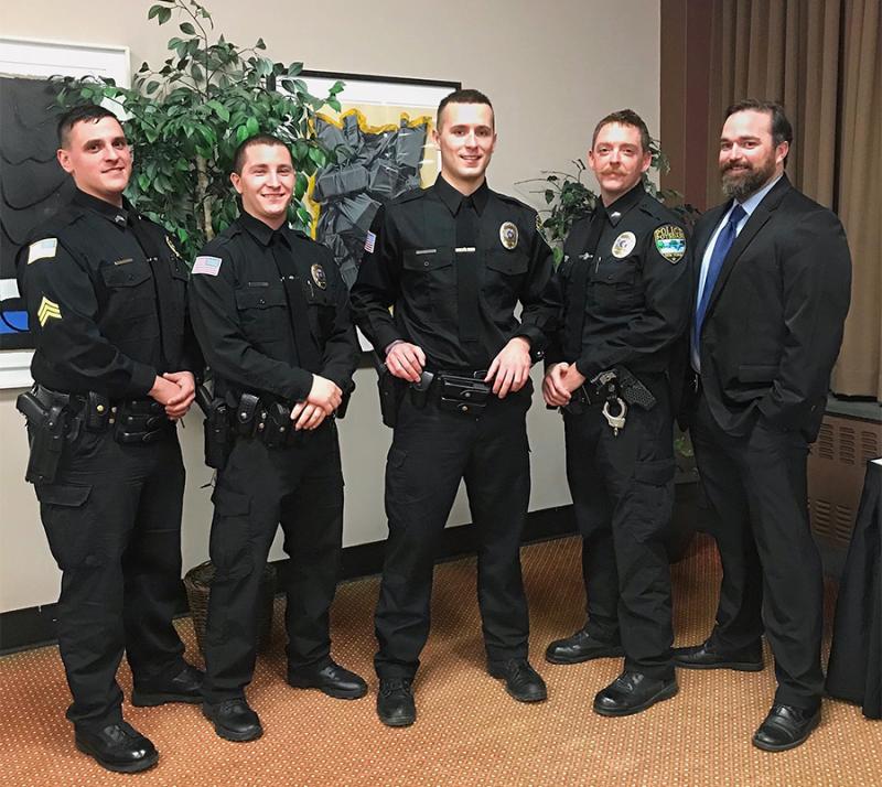 Members of the Potsdam Village Police department gathered with two new hired officers 