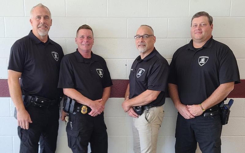 Three officers receiving patrolman peace officer certifications