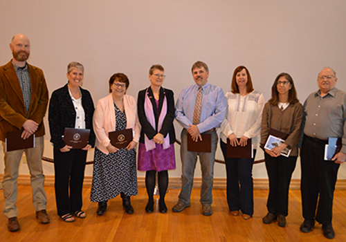 The 2019 President’s Award recipients posed with President Kristin Esterberg after receiving their honors. From left, Timothy Messner, Tracy Harcourt, Karen Miller, Kristin Esterberg, Roy Smith, Kristin Jordan, M.J. Heisey and John Bard (not pictured: Marcy Lottie and Mark Campbell).