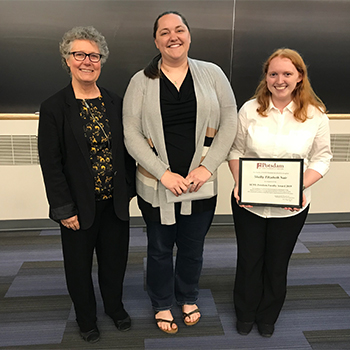 From left, Faculty Senate Chair Kim Bouchard with Dr. Jessica Heffner and 2019 Faculty Award recipient Shelby Nair. Heffner is the student's academic advisor and mentor.